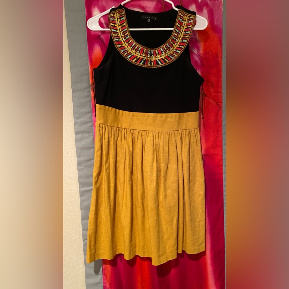 Linen dress with embroidery detail.